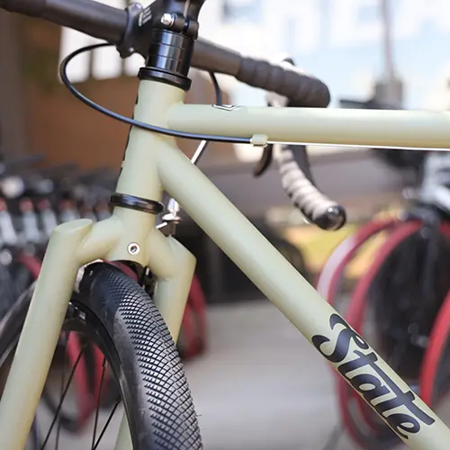 A green bicycle outdoors.