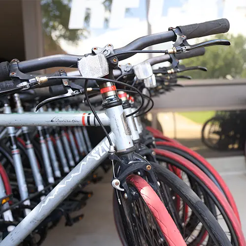 Red and grey bikes sitting outside the Outdoor Recreation shop.