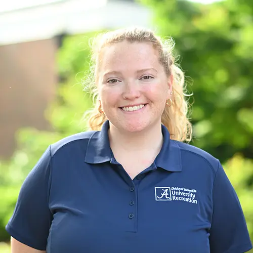 Smiling young woman wearing a navy blue