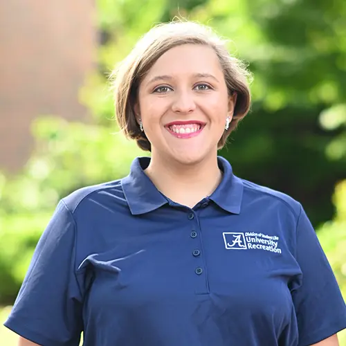Smiling young woman wearing a navy blue