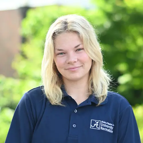 Smiling young woman wearing a navy blue