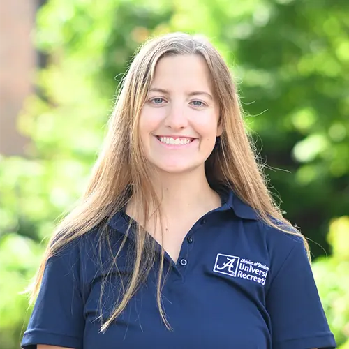 Smiling young woman wearing a navy blue