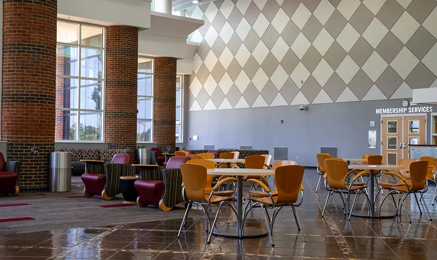 A lobby with table and chairs.